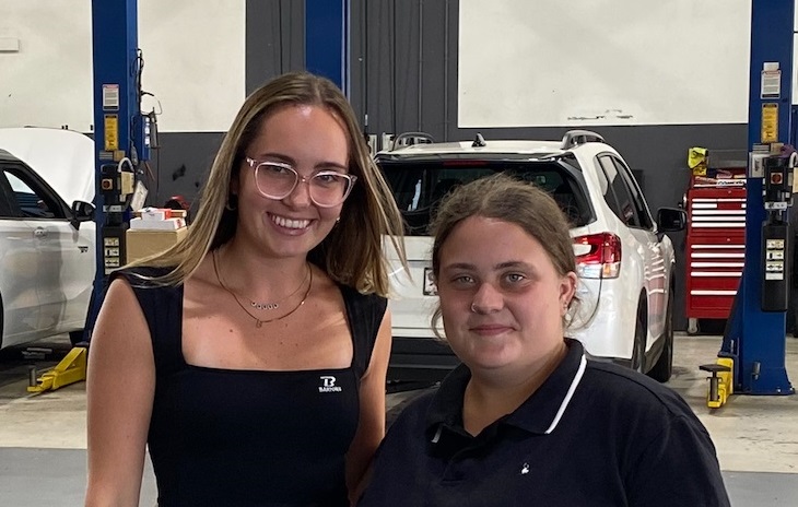 Employer with school student in workplace